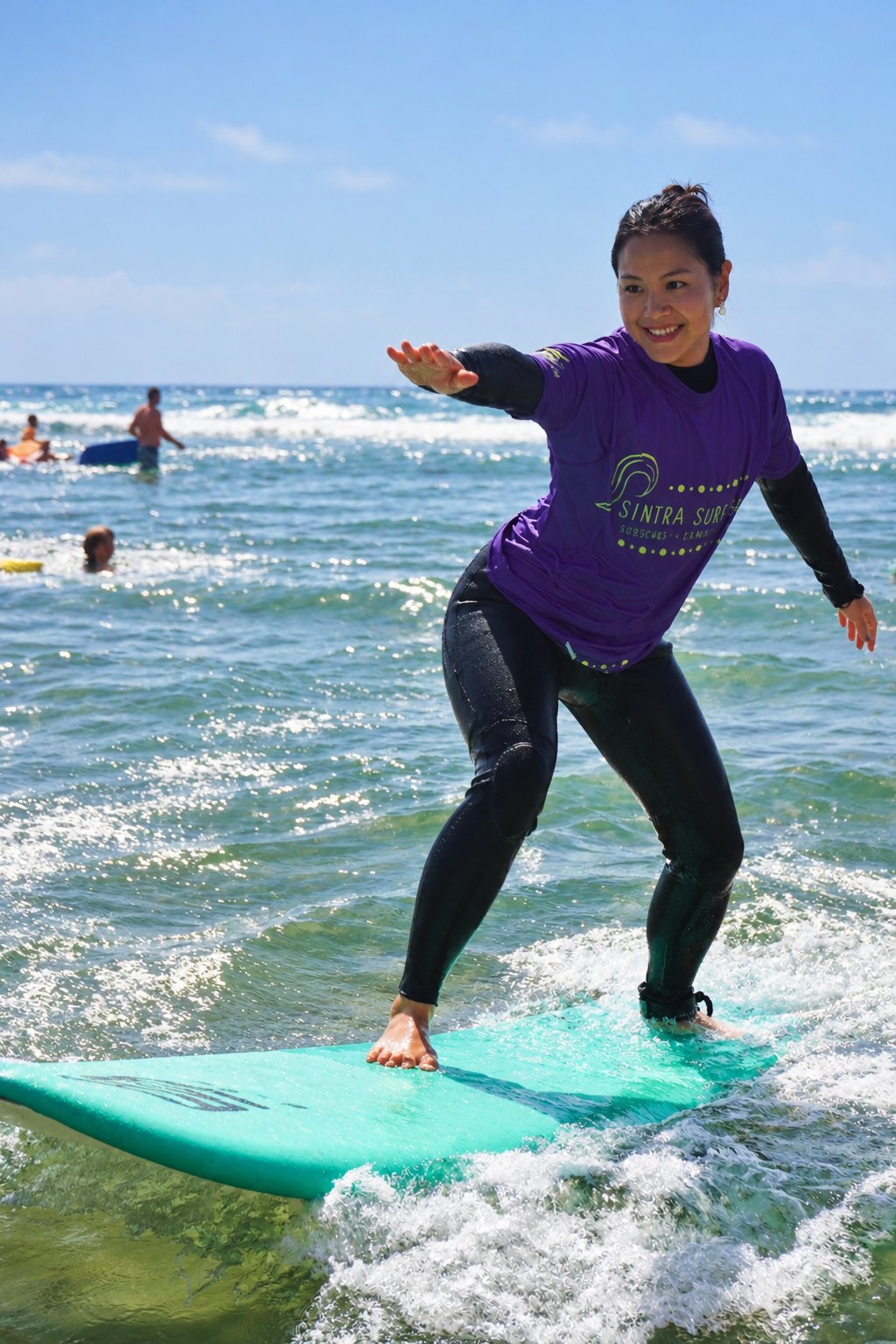 Riding the first wave in the surf lesson