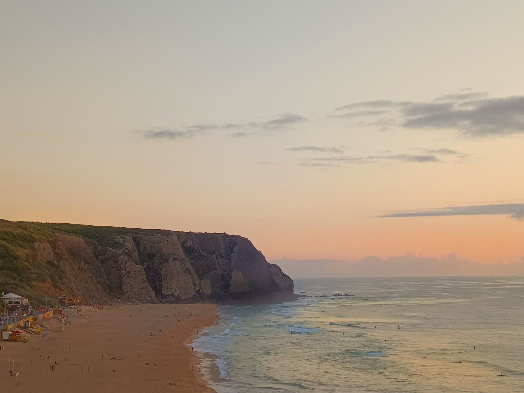 Soft sunset light over Praia Grande and its Atlantic cliffs